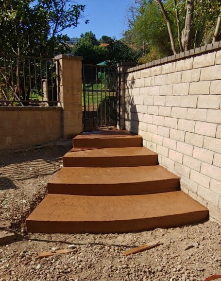 new colored concrete stairs with stamped concrete